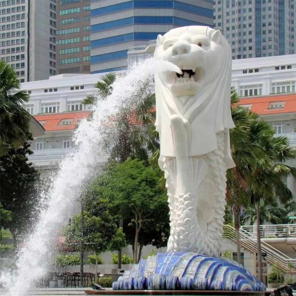 stone water fountain with fish statue
