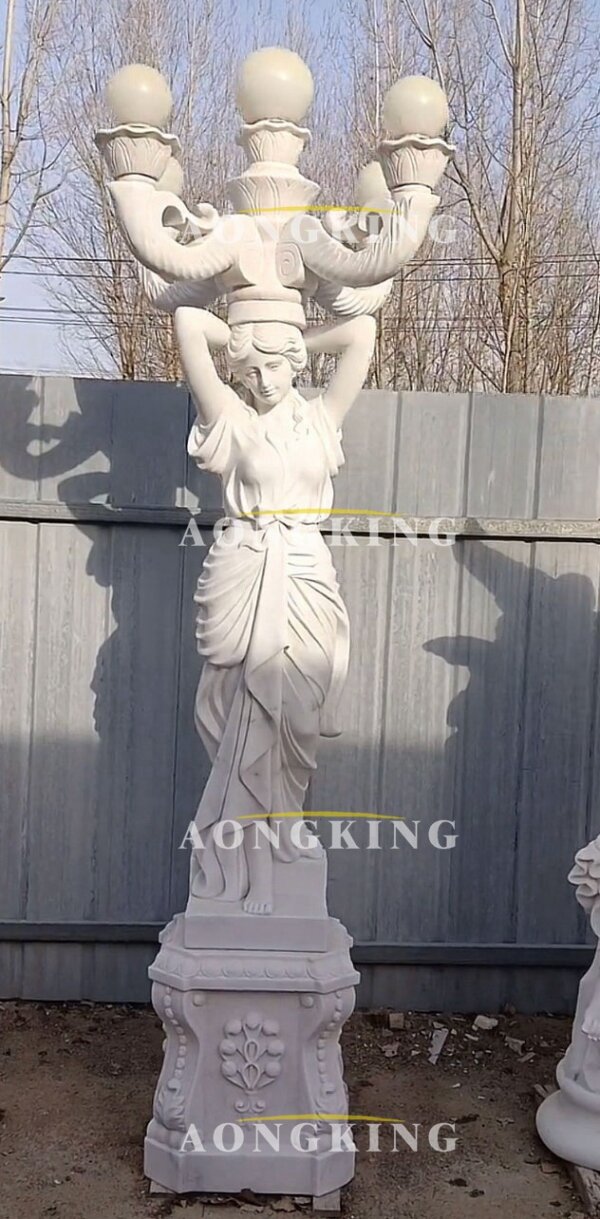goddess statue holding lamp