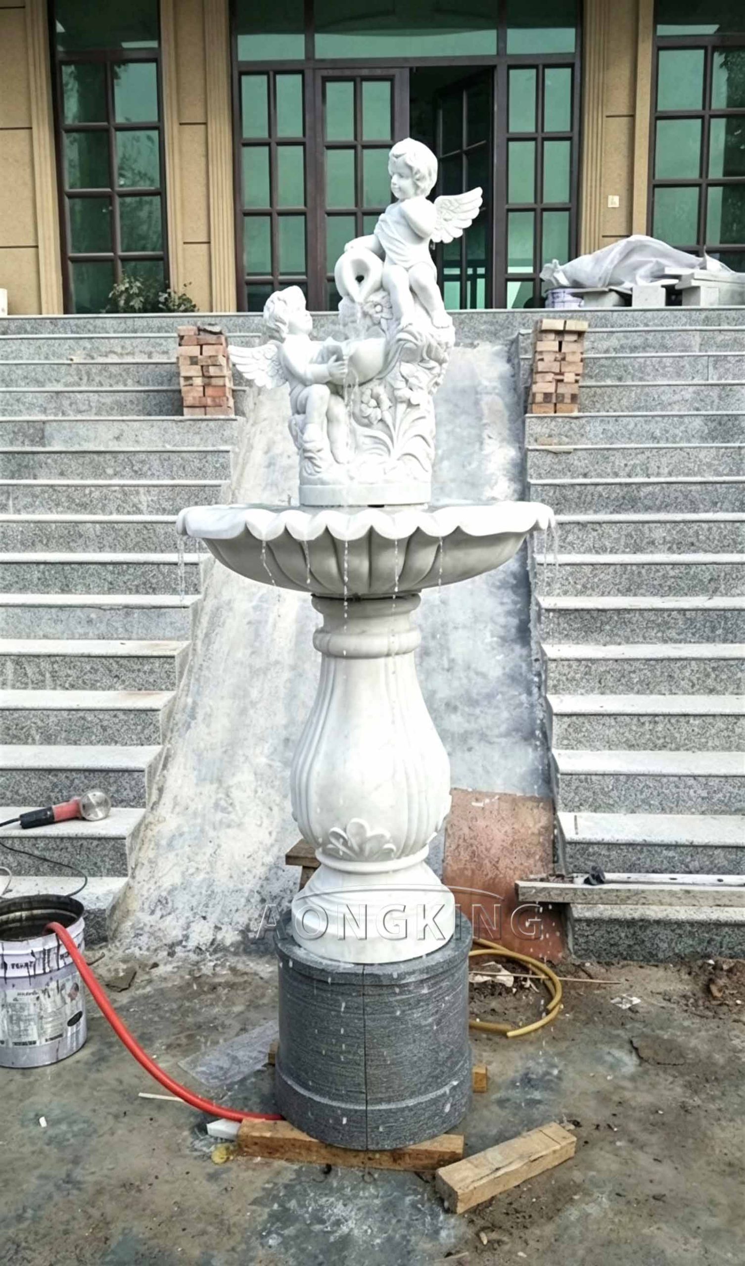 Elaborately crafted standalone marble angel garden fountain entrance private mansion